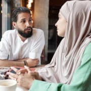 Muslim Couple In Modern Cafe