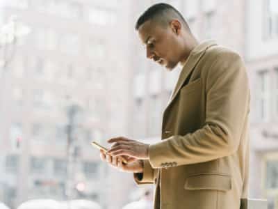 Portrait of businessman looking at smartphone