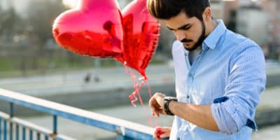 Sad man waiting for date on valentine date